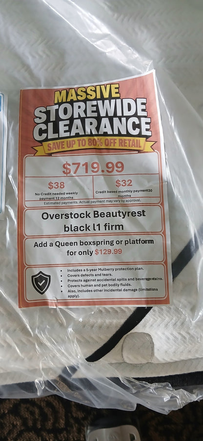 Overstock Beautyrest Black L1 Firm Queen Mattress - price tag close-up