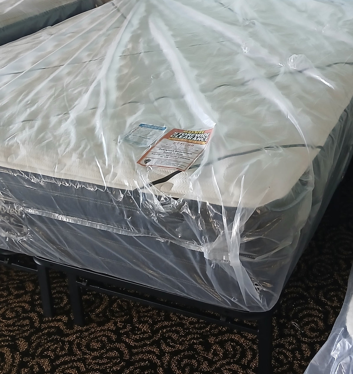 Overstock Beautyrest Black L1 Firm Queen Mattress - Eastman floor photo